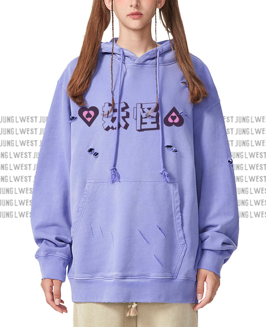Person wearing a purple hoodie with graphic designs on a white background