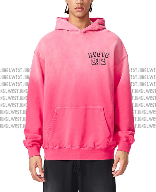 Person wearing a pink hoodie with text on a white background