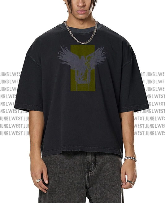Person wearing a black t-shirt with a graphic design on a white background