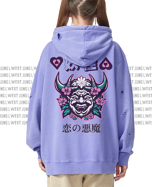 Person wearing a purple hoodie with a graphic design on the back